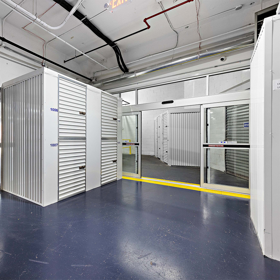 Interior storage units with roll-up doors and glass access doors at StorageBlue Ferry Street