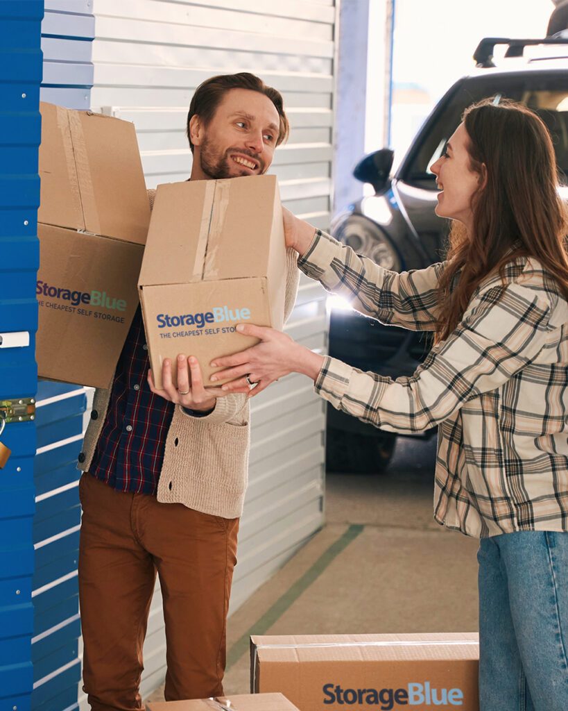 Photo of a happy couple moving into their new StorageBlue self-storage unit.